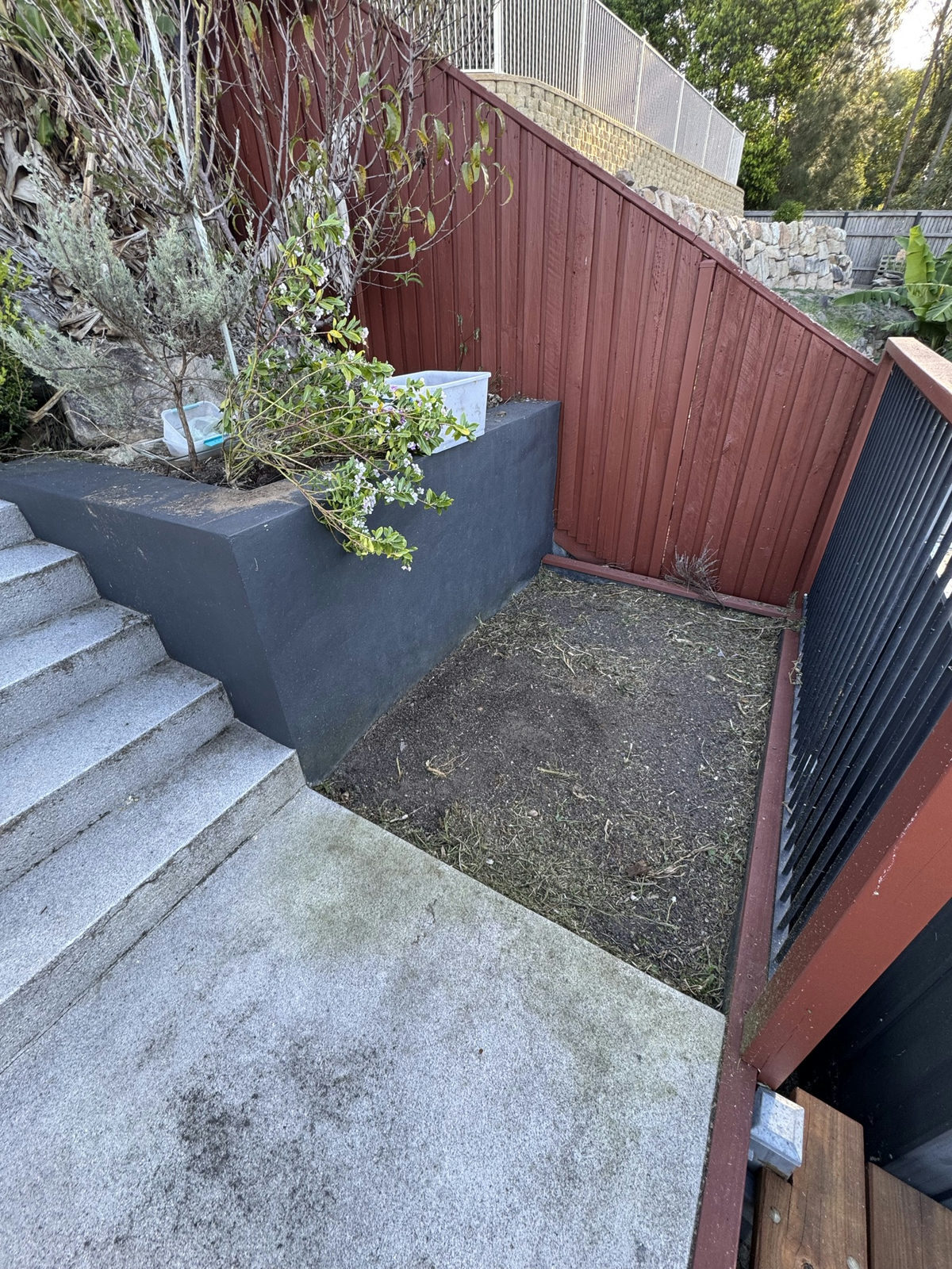 The Holmview planter cut back with the concrete steps and planter edge clear
