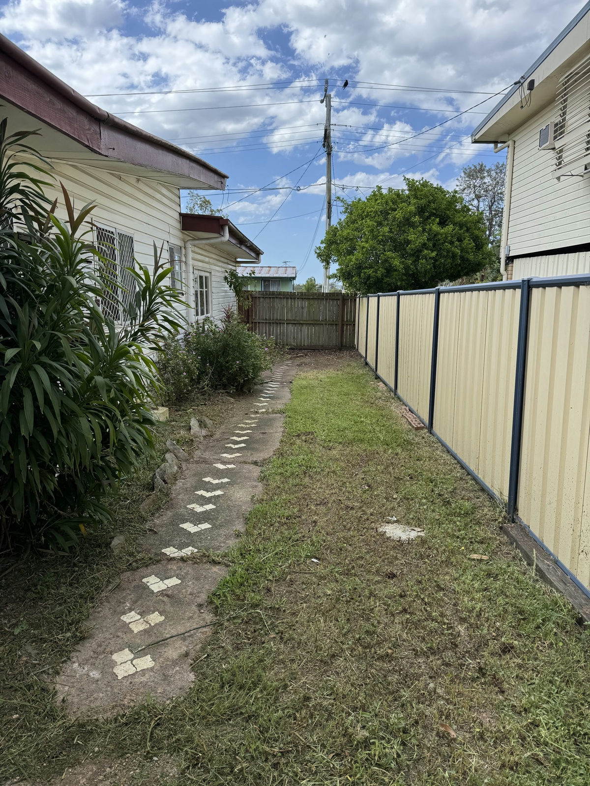 The Logan Central stepping stone path uncovered and walkable after clearing