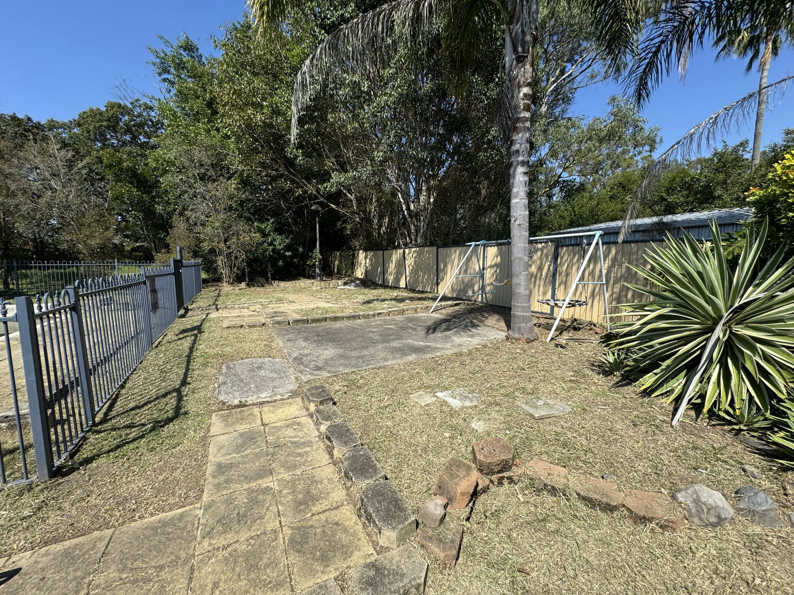 The Marsden courtyard cleared with the sandstone pavers and rock edging fully exposed