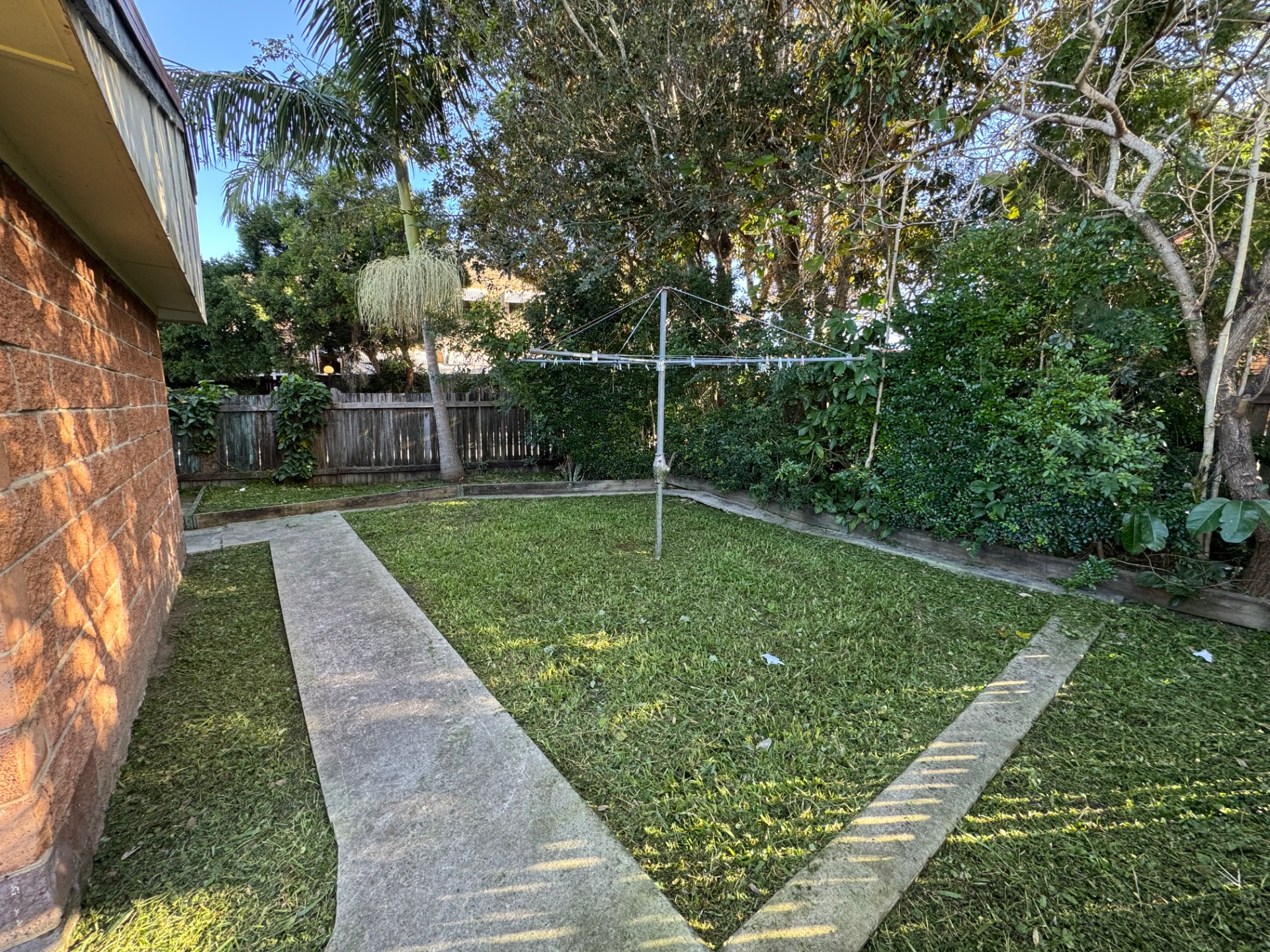 After: Woodridge duplex front yard transformation - before and after comparison